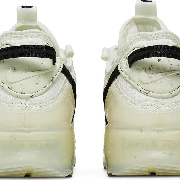 White sneakers with black accents on a white background