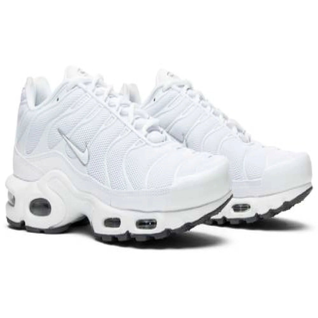 White Nike sneakers with air cushion sole on a white background