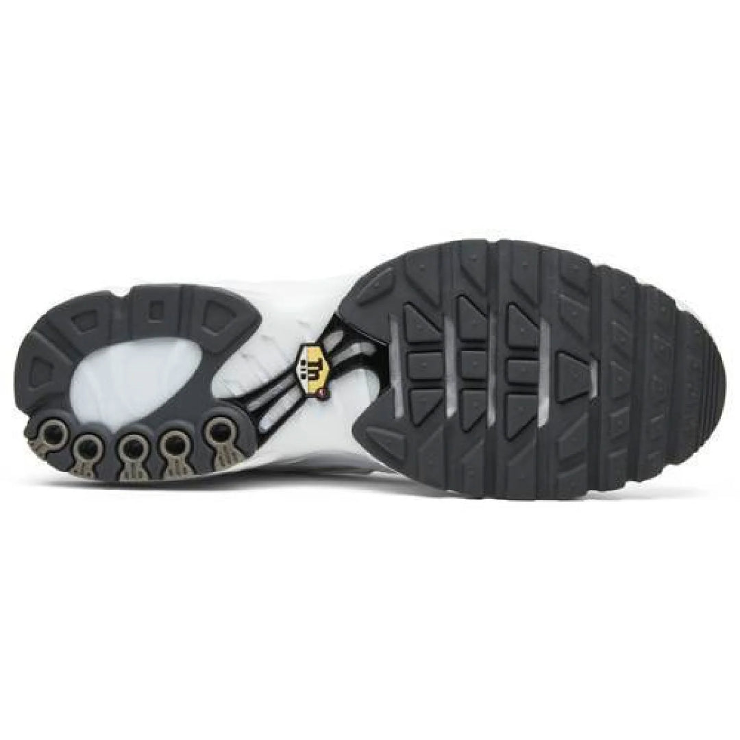 Close-up of a shoe sole with a brand logo on a white background