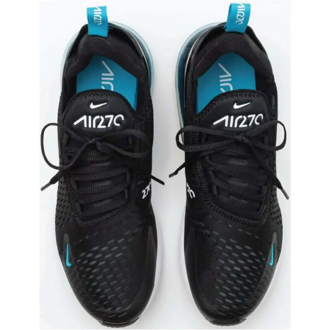 Black sneakers with blue accents on a white background